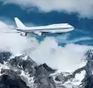Fototapeta Samolot Lecący Nad Górami Ośnieżone.