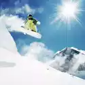 Myloview Fototapeta Snowboarder W Górach Inhigh Jump